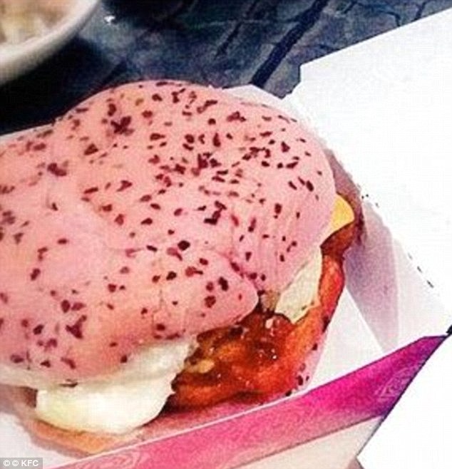 Eating chicken from between two pink buns is the scene to greet you in KFC, China